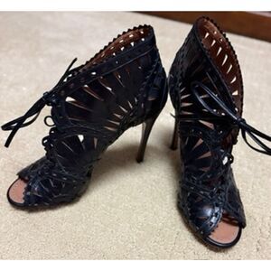 ALAÏA Black Leather Laser-Cut Out Vienne Motif Sandal Heels